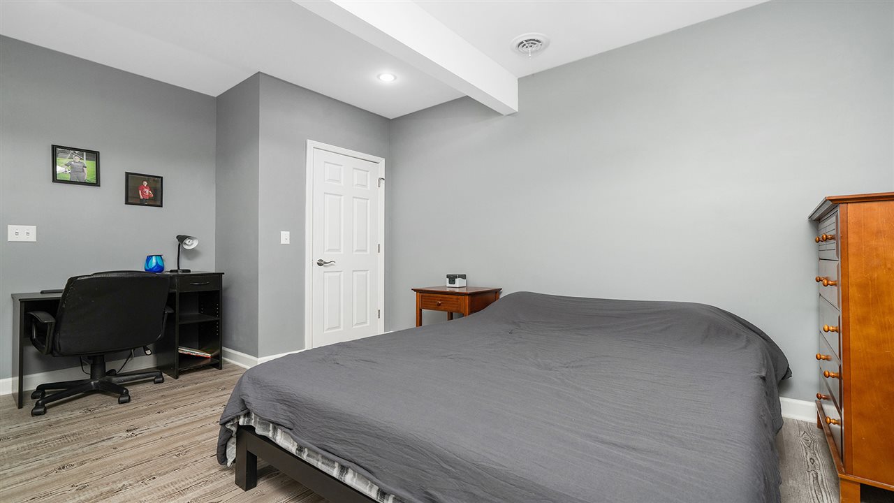 2525 Rogene Drive Oregon, IL 61061 - Photo 28 of 36 a bedroom with a bed and a chair