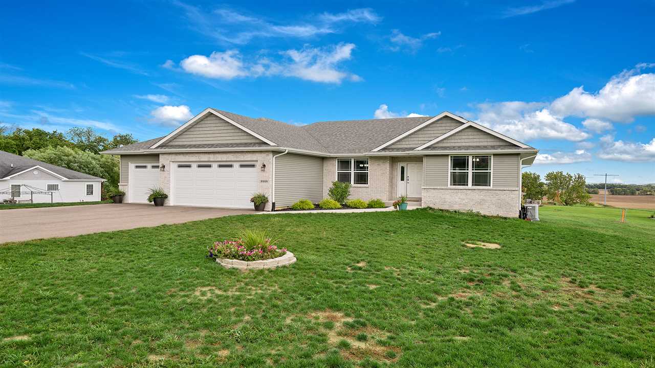 2525 Rogene Drive Oregon, IL 61061 - Photo 35 of 36 a front view of a house with a garden