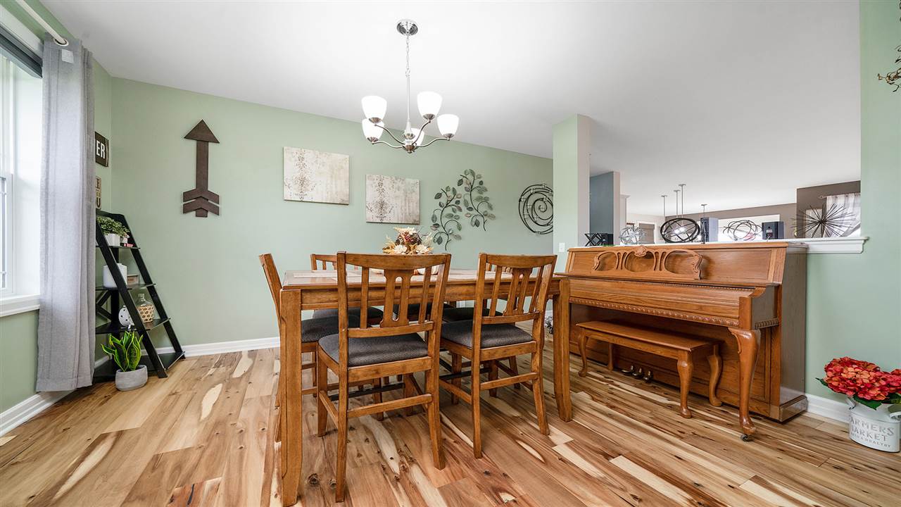 2525 Rogene Drive Oregon, IL 61061 - Photo 4 of 36 a view of a dining room with furniture and wooden floor