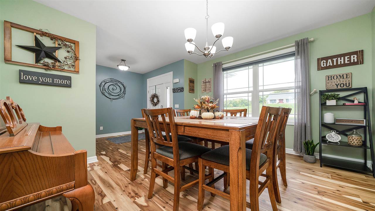 2525 Rogene Drive Oregon, IL 61061 - Photo 5 of 36 a view of a dining room with furniture window and wooden floor