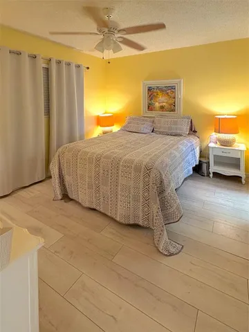 a bedroom with a bed and a table