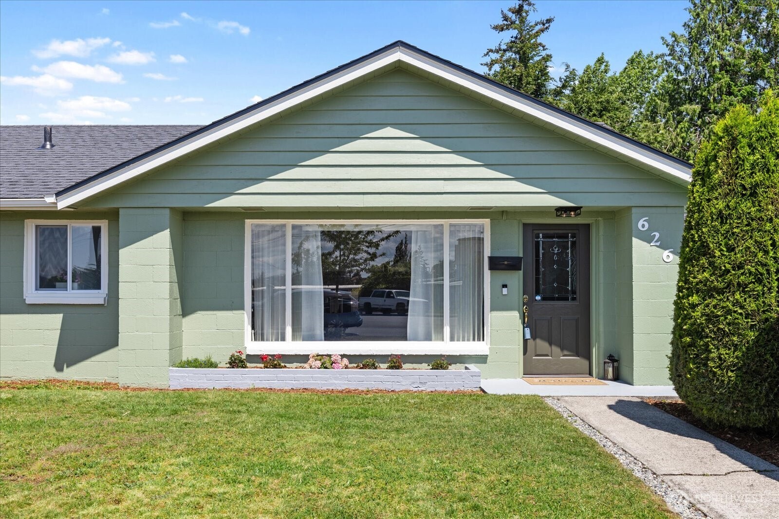 626 Legion Drive Everett, WA 98201 - Photo 2 of 38 a front view of a house with a yard