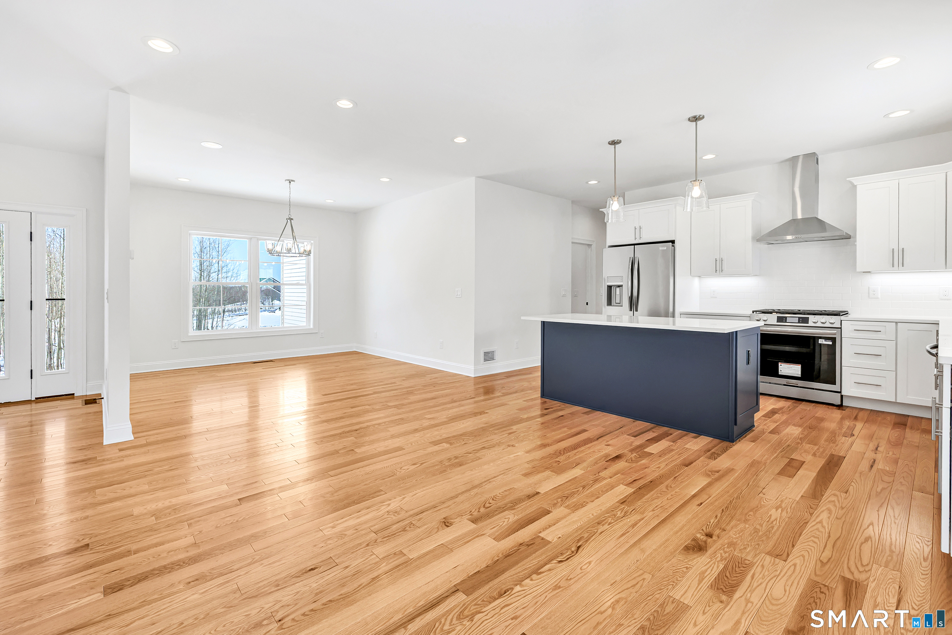 15 Hunting Ridge Road Middlebury, CT 06762 - Photo 11 of 38 a view of kitchen with wooden floor and window