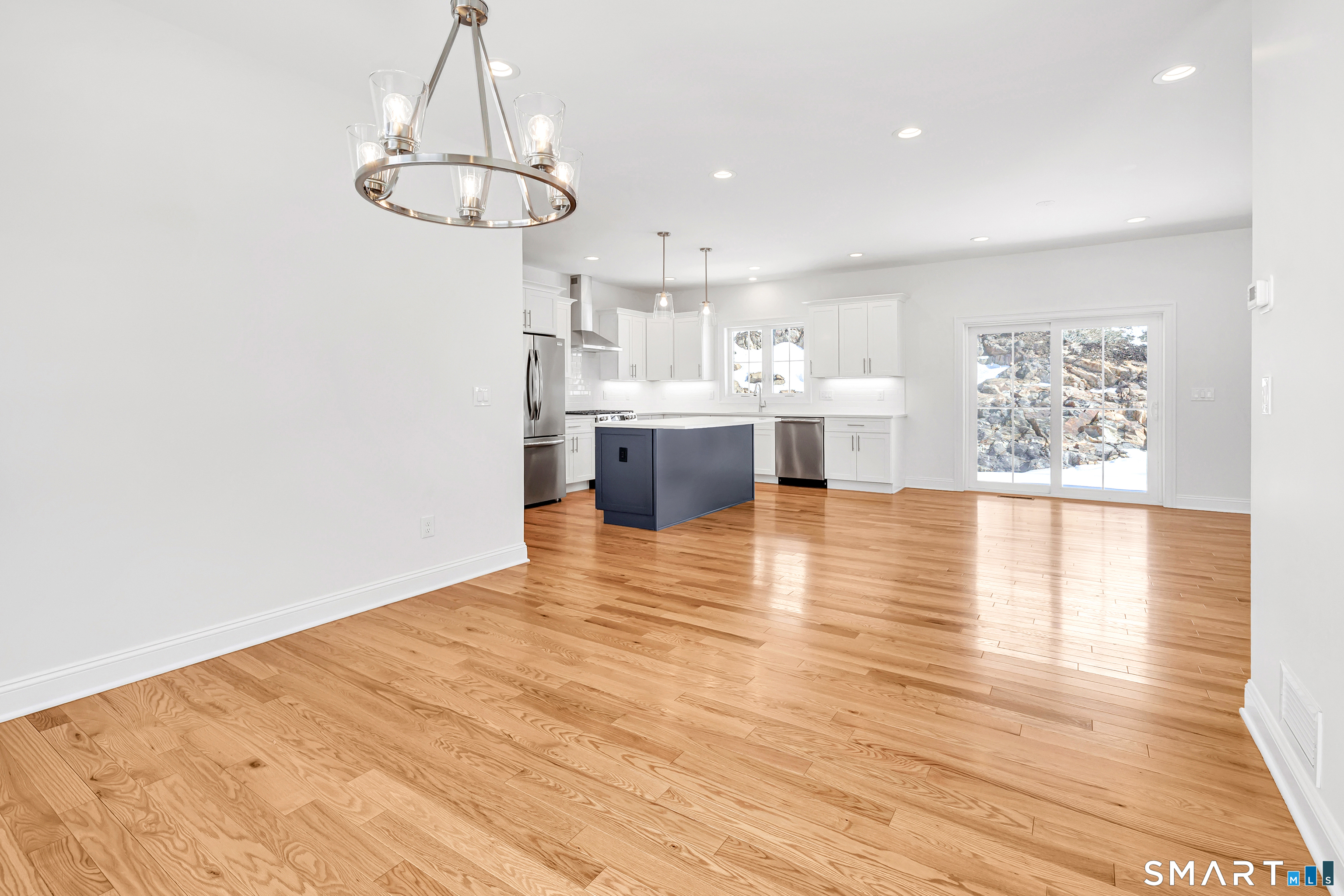 15 Hunting Ridge Road Middlebury, CT 06762 - Photo 17 of 41 a view of kitchen and dining room with wooden floor