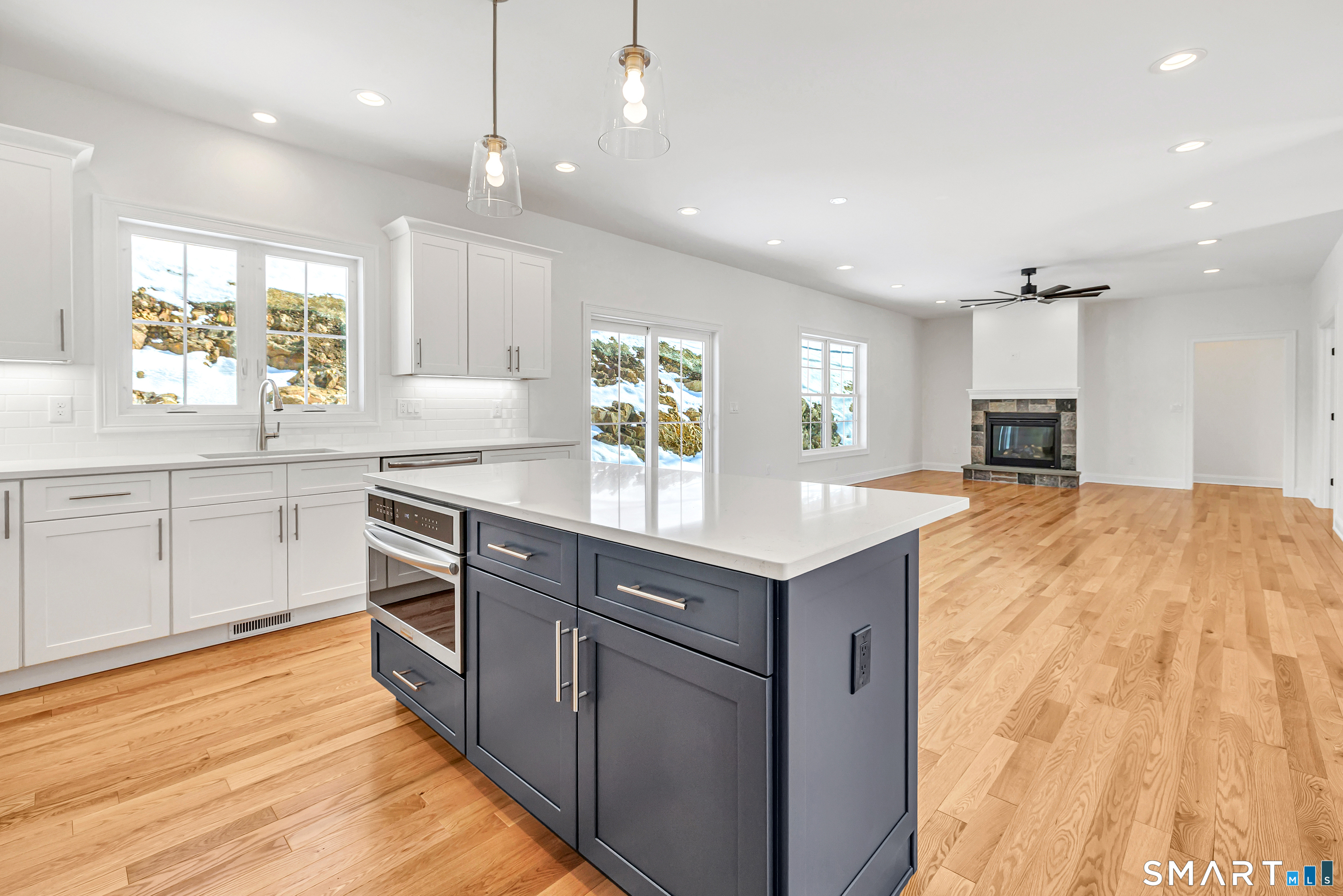 15 Hunting Ridge Road Middlebury, CT 06762 - Photo 18 of 38 a large kitchen with kitchen island a sink stainless steel appliances and cabinets