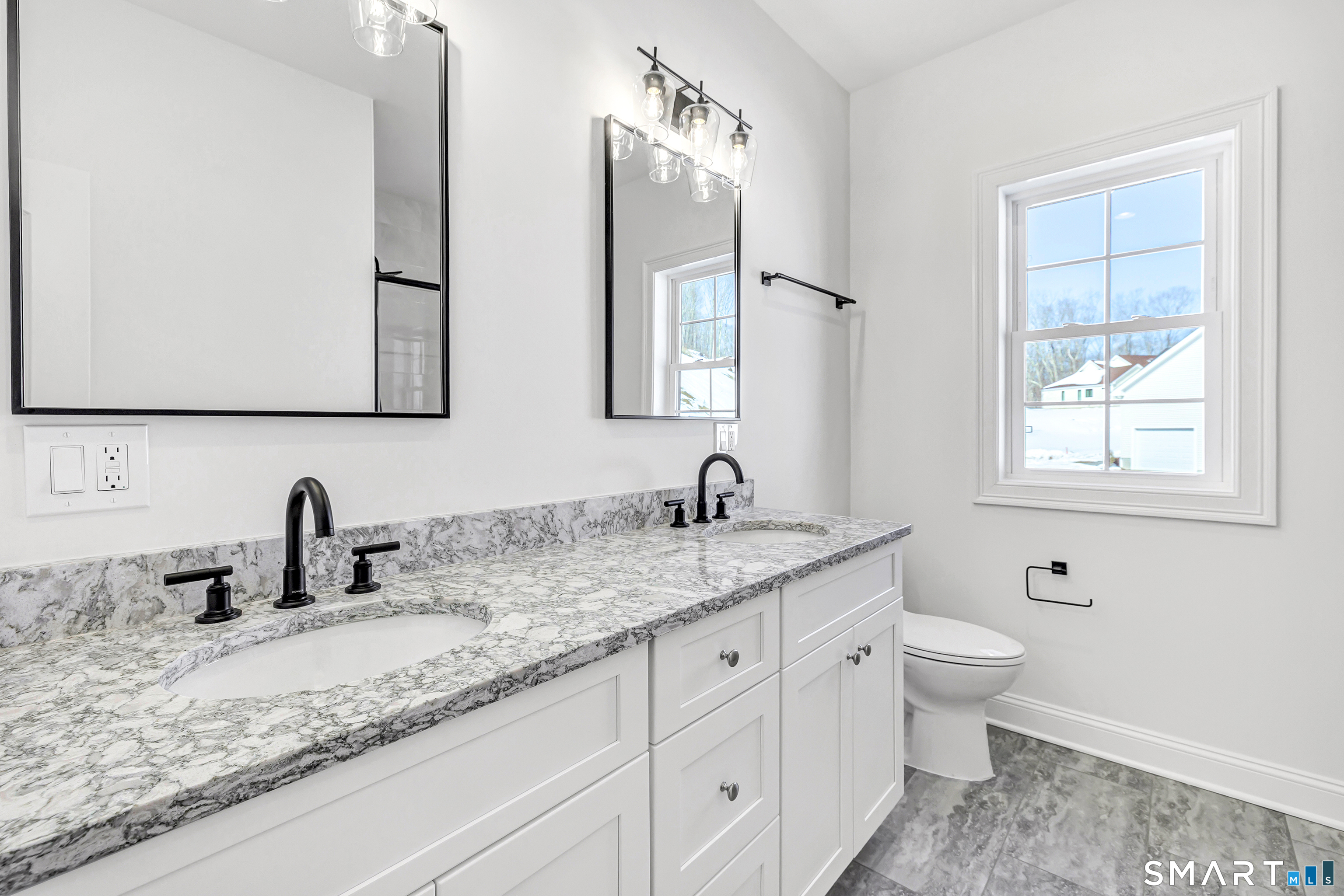 15 Hunting Ridge Road Middlebury, CT 06762 - Photo 22 of 38 a bathroom with double sink and a mirror