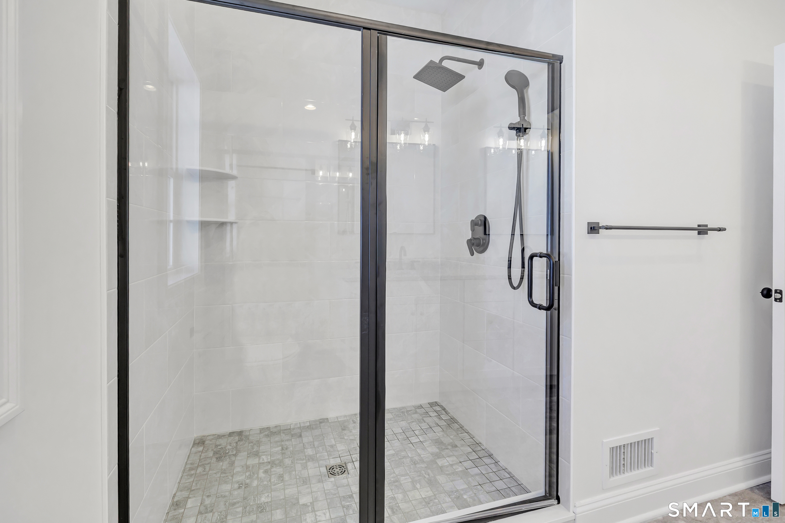 15 Hunting Ridge Road Middlebury, CT 06762 - Photo 23 of 38 a bathroom with a glass shower door