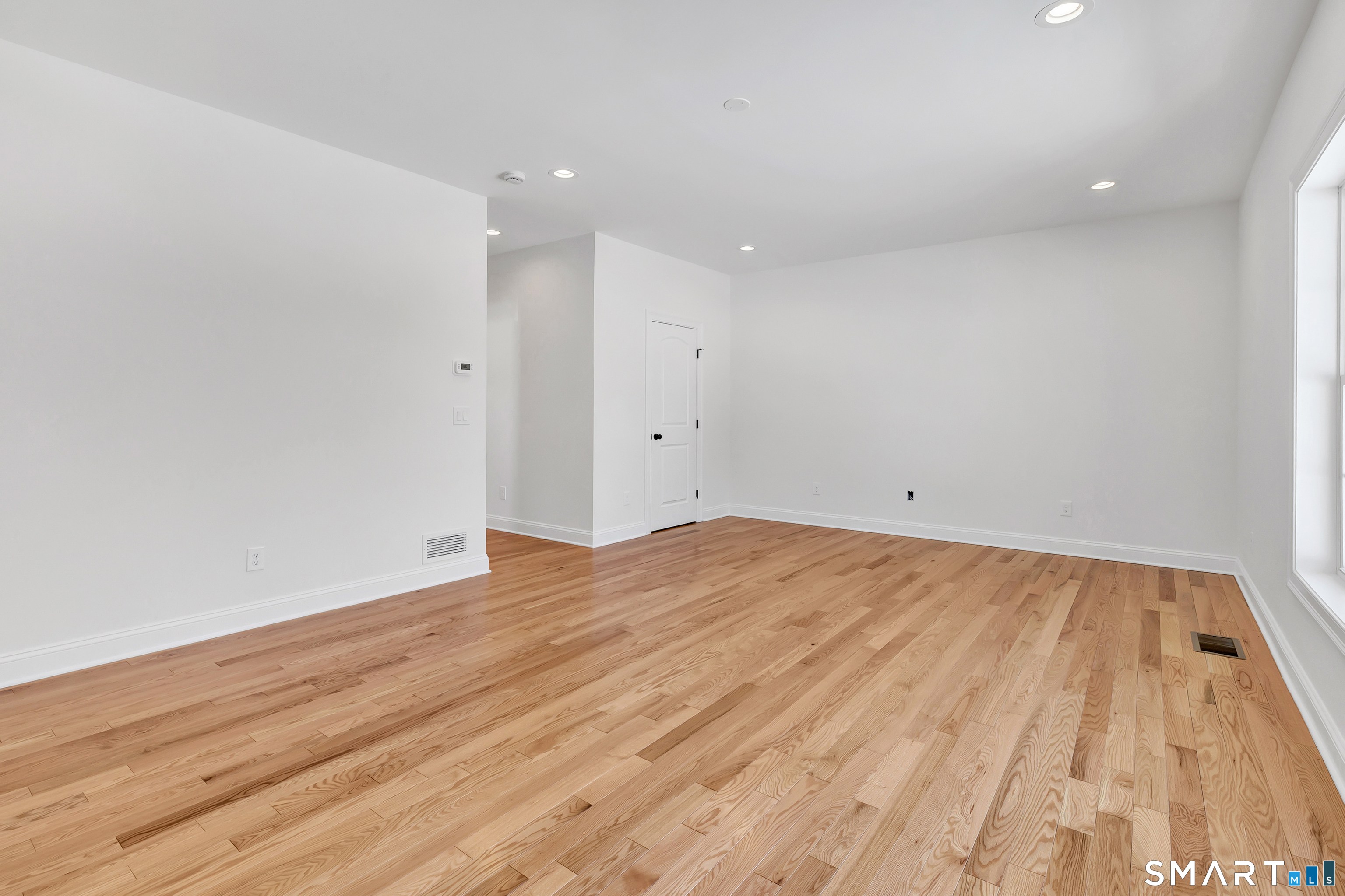 15 Hunting Ridge Road Middlebury, CT 06762 - Photo 25 of 38 a view of empty room with wooden floor
