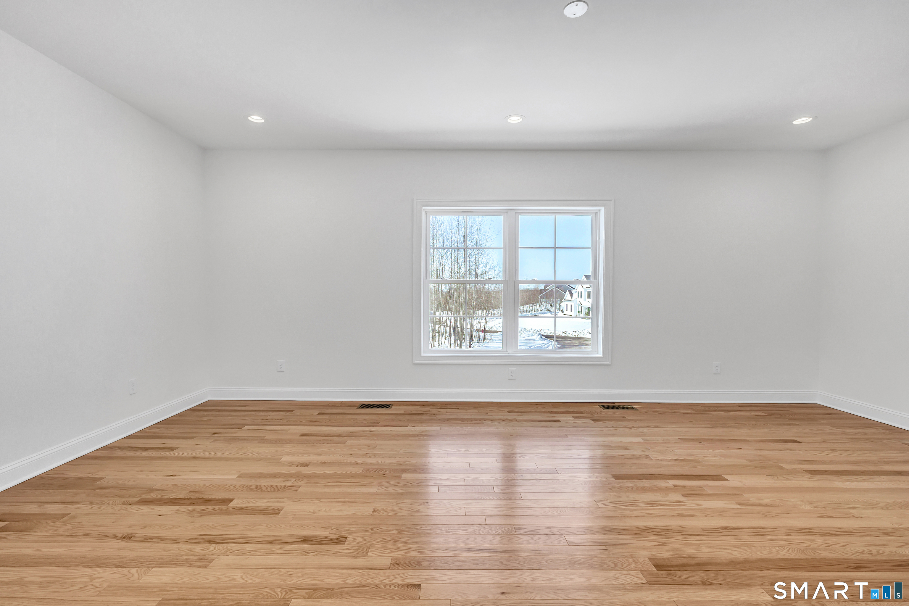 15 Hunting Ridge Road Middlebury, CT 06762 - Photo 27 of 41 a view of an empty room with wooden floor and a window