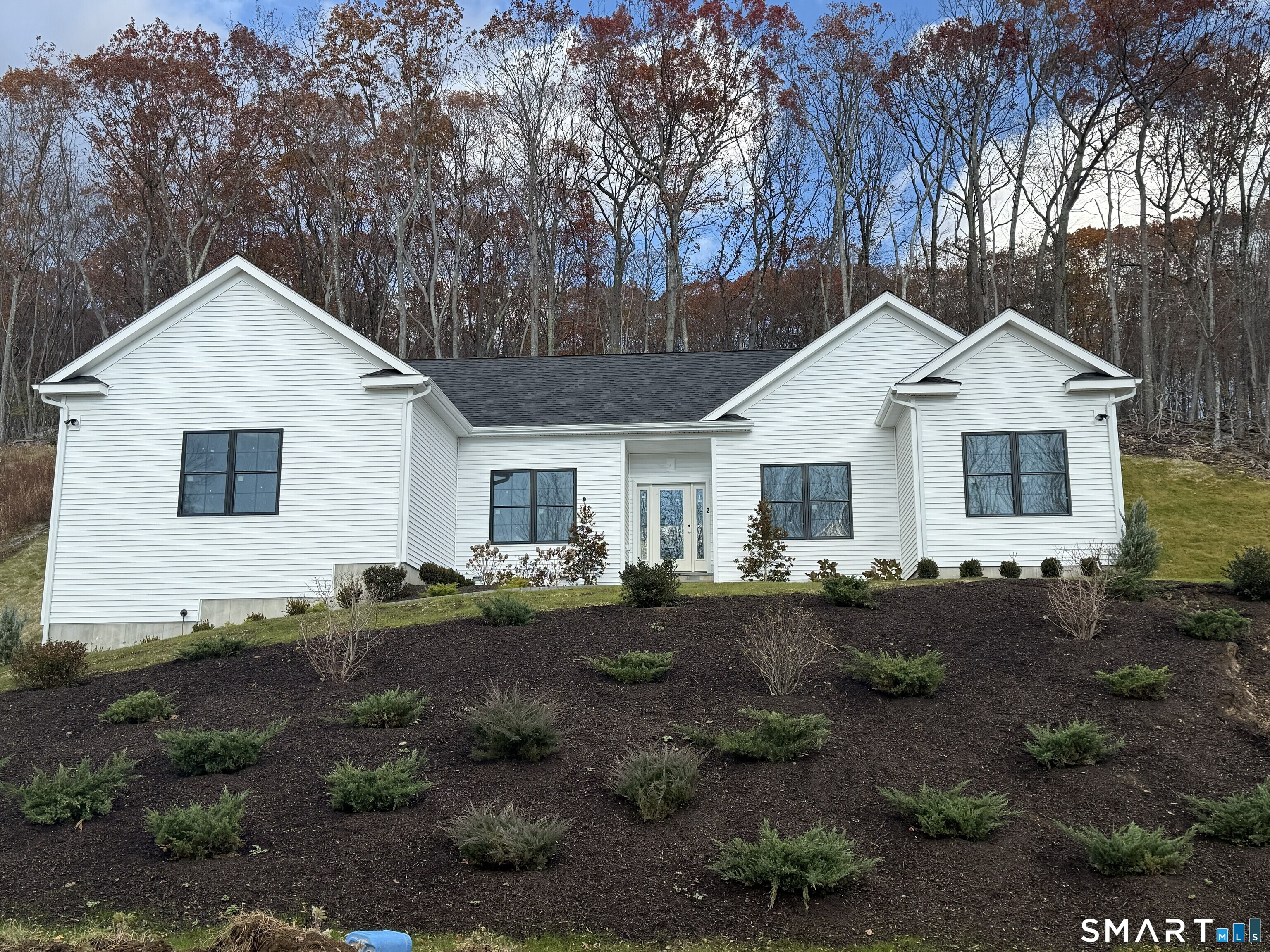 15 Hunting Ridge Road Middlebury, CT 06762 - Photo 3 of 41 a front view of a house with garden