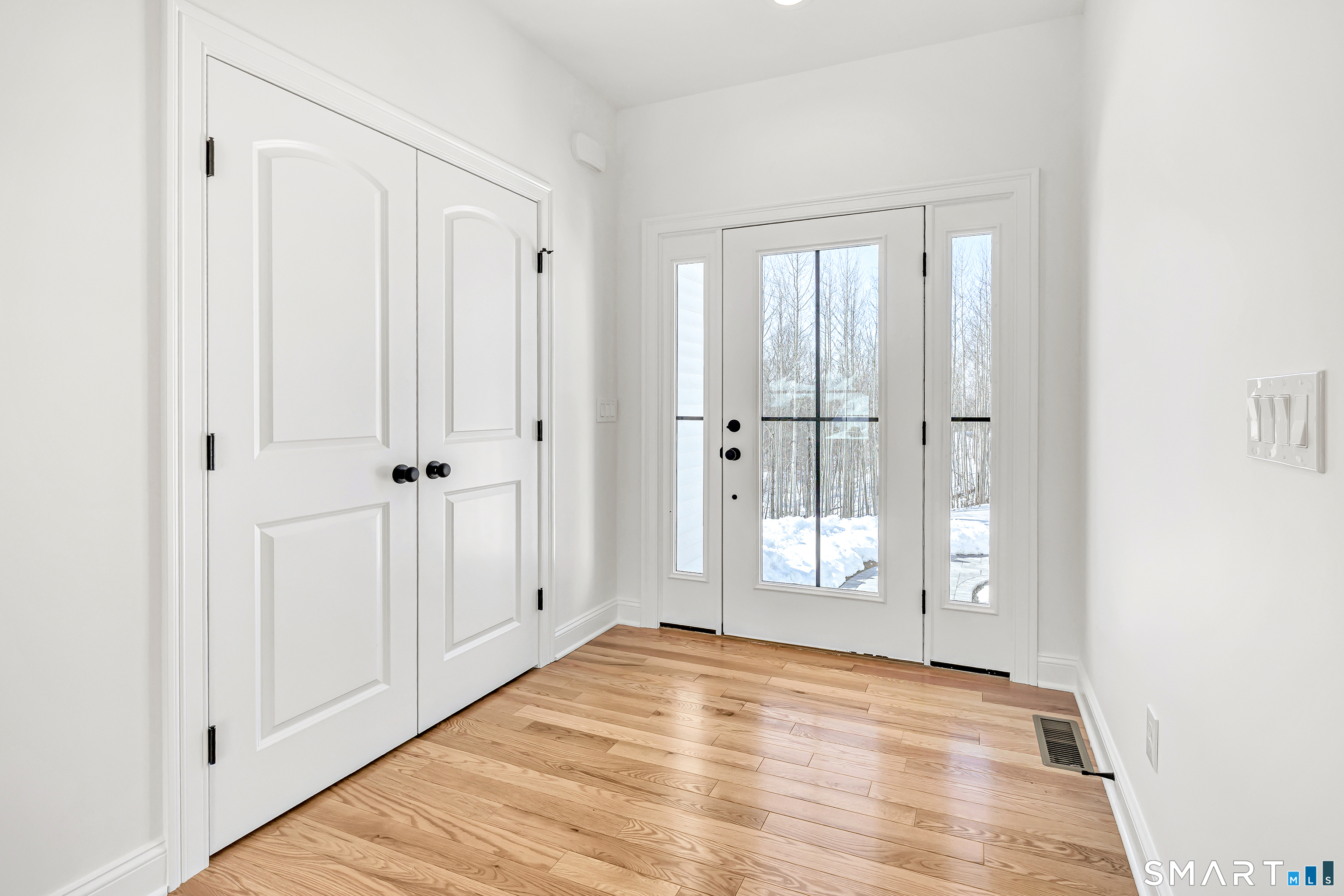 15 Hunting Ridge Road Middlebury, CT 06762 - Photo 3 of 38 a view of an empty room with wooden floor