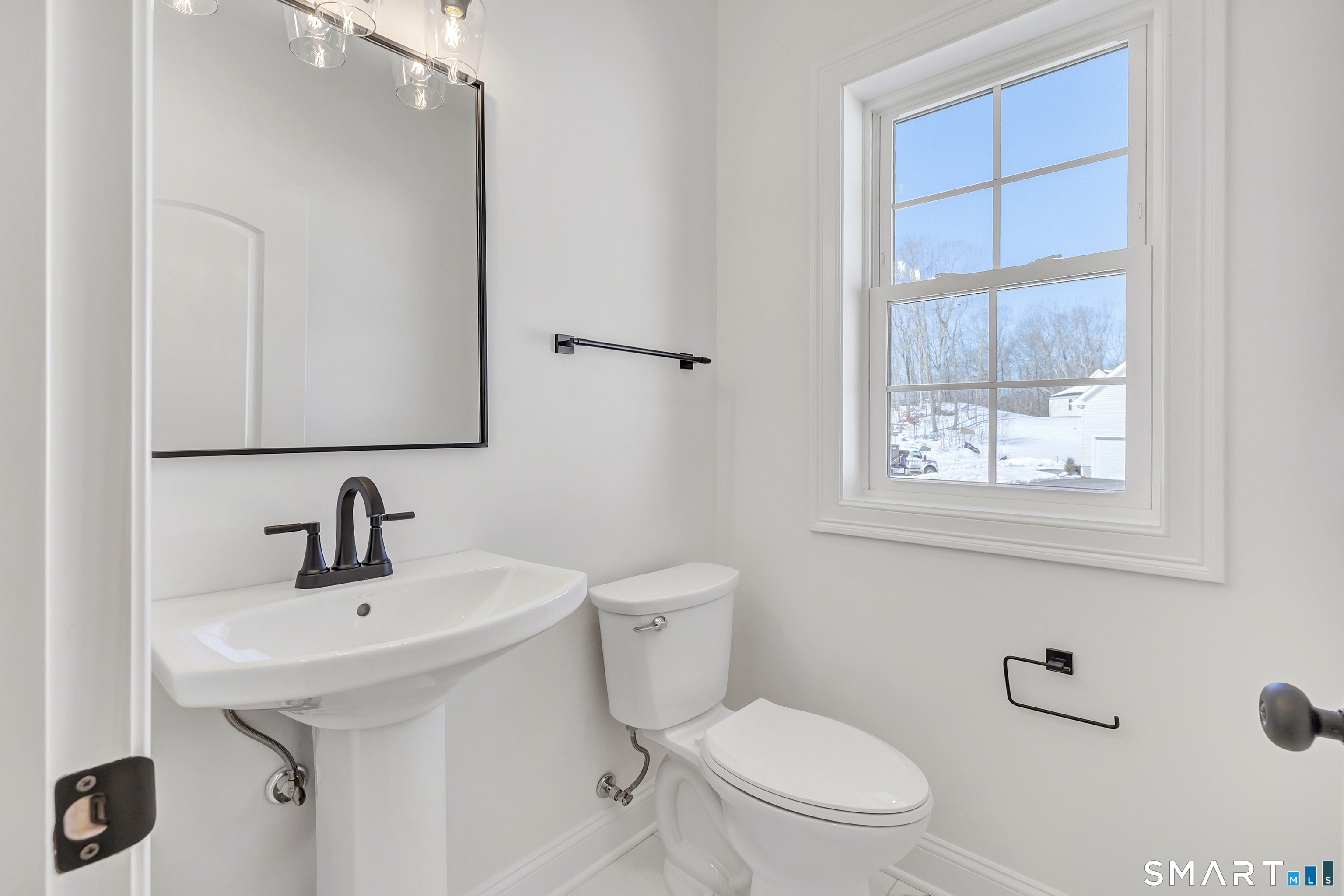 15 Hunting Ridge Road Middlebury, CT 06762 - Photo 31 of 41 a bathroom with a sink a toilet and a window