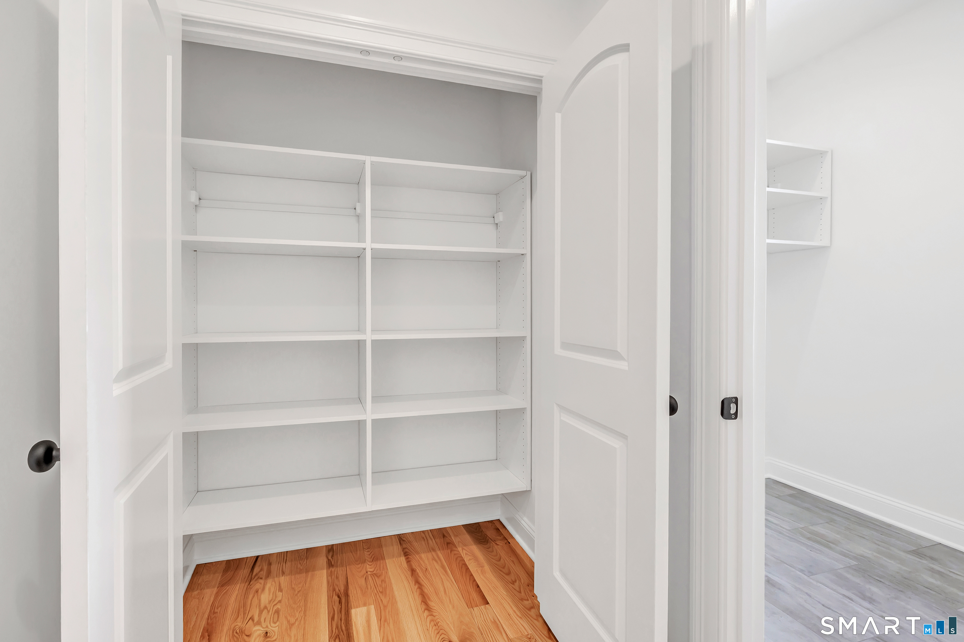 15 Hunting Ridge Road Middlebury, CT 06762 - Photo 32 of 41 a view of walk in closet with empty racks