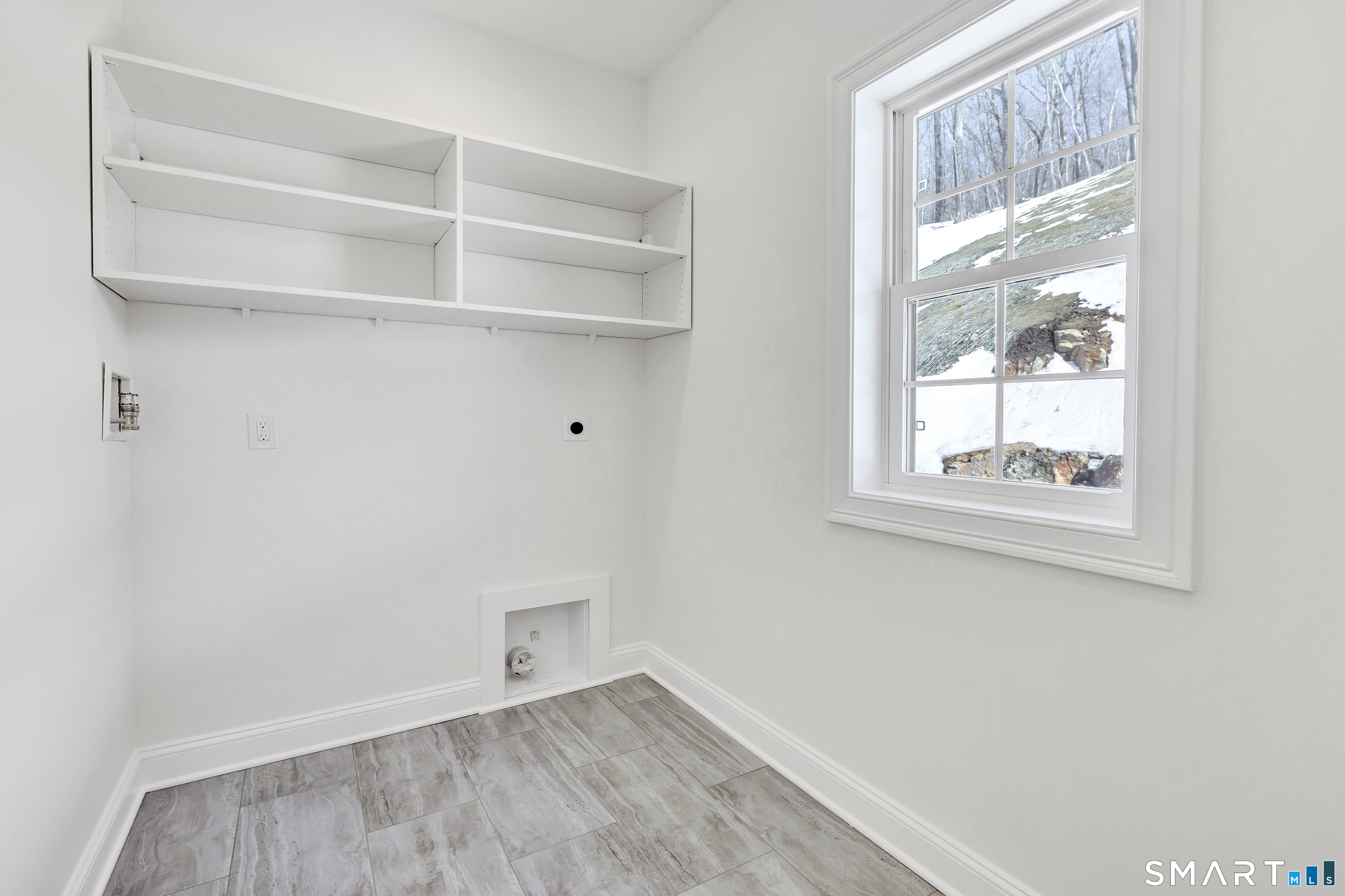 15 Hunting Ridge Road Middlebury, CT 06762 - Photo 33 of 41 a view of an empty room with wooden floor and a window