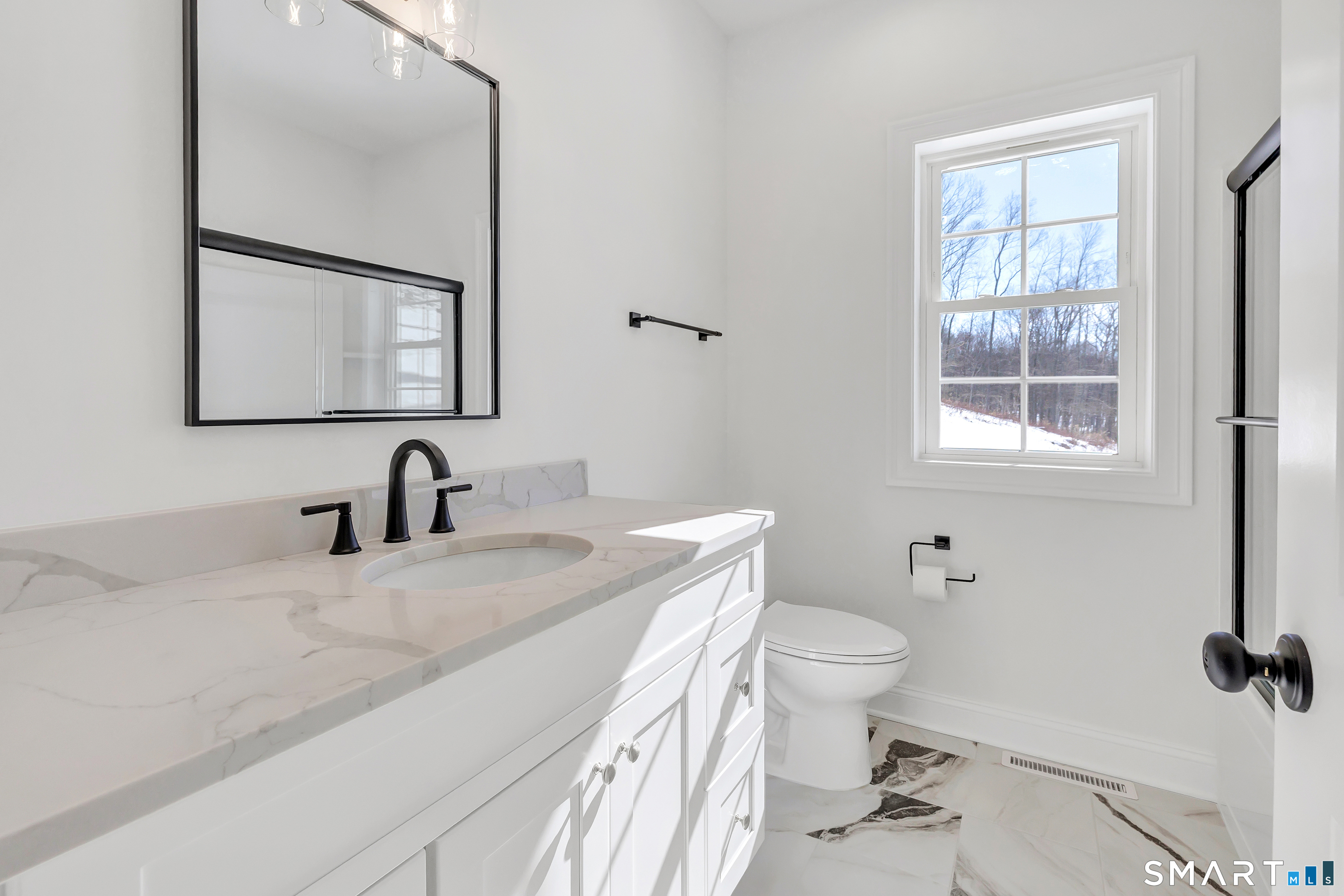 15 Hunting Ridge Road Middlebury, CT 06762 - Photo 36 of 38 a bathroom with a granite countertop sink toilet and mirror