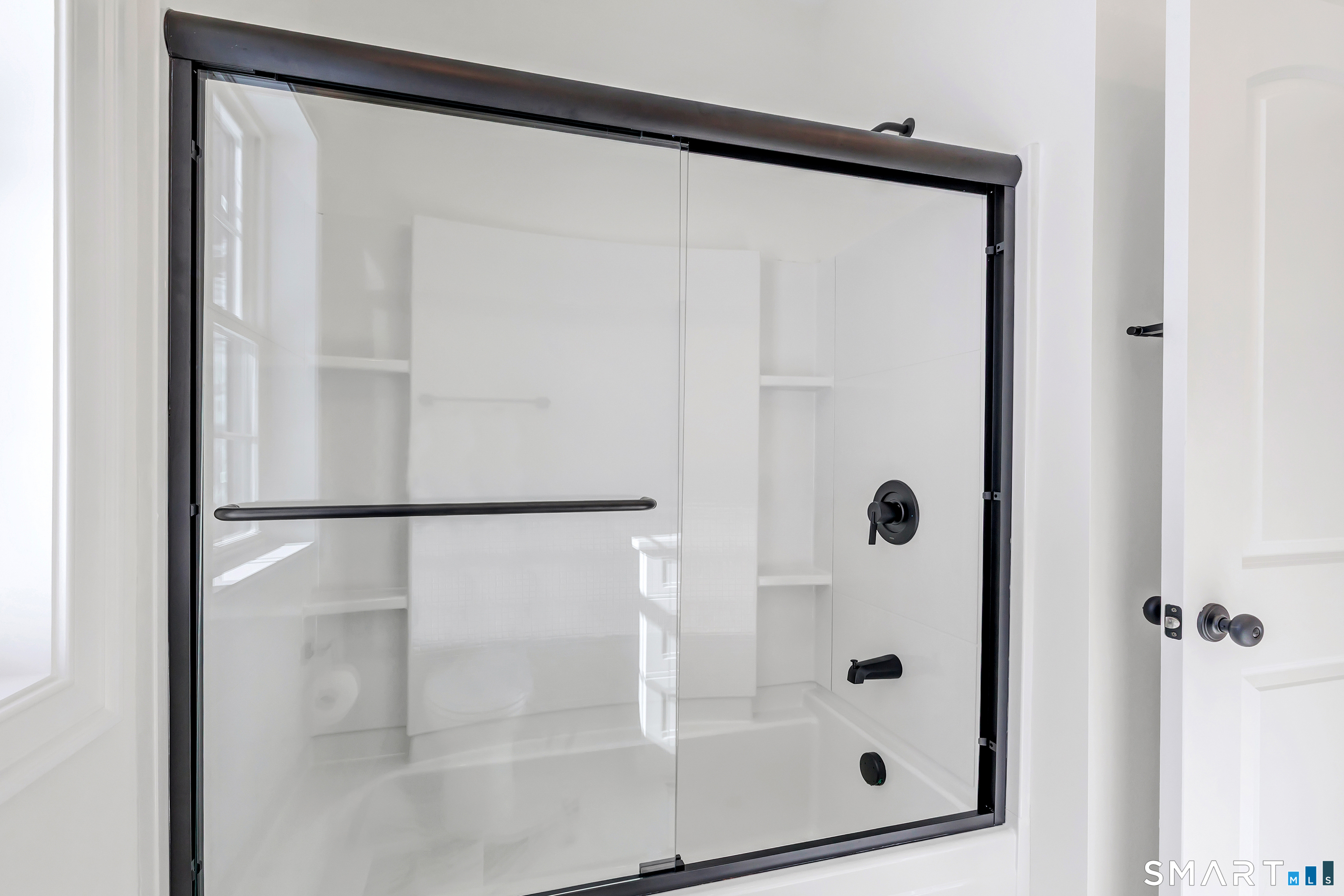 15 Hunting Ridge Road Middlebury, CT 06762 - Photo 40 of 41 a bathroom with a glass shower door