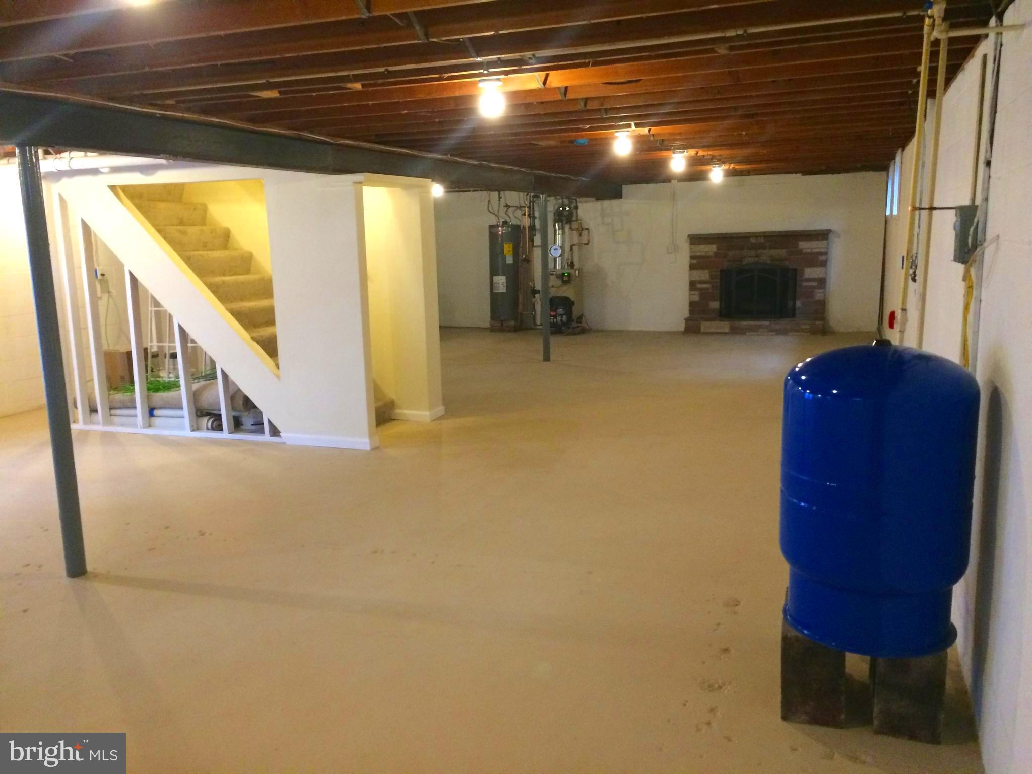 720 West Watersville Road Mount Airy, MD 21771 - Photo 23 of 30 Basement with fireplace and new well pressure tank