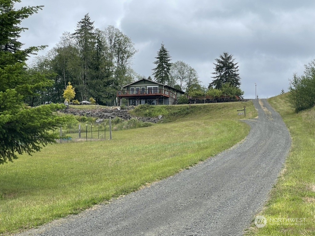 300 Bush Creek Road Elma, WA 98541 - Photo 18 of 21 a view of a lake with a yard