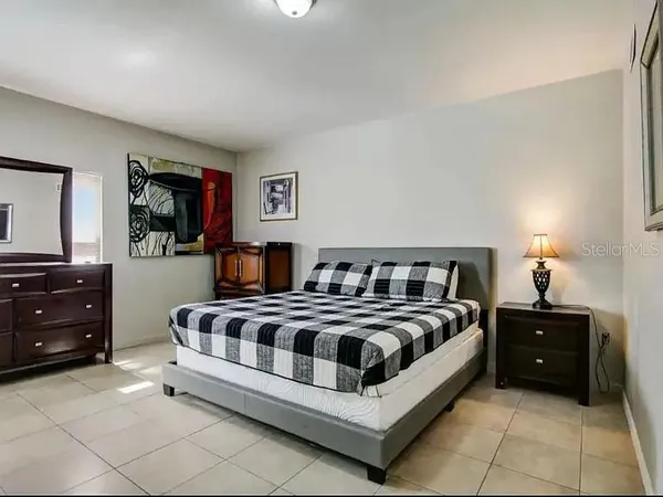 a bedroom with a bed and a closet