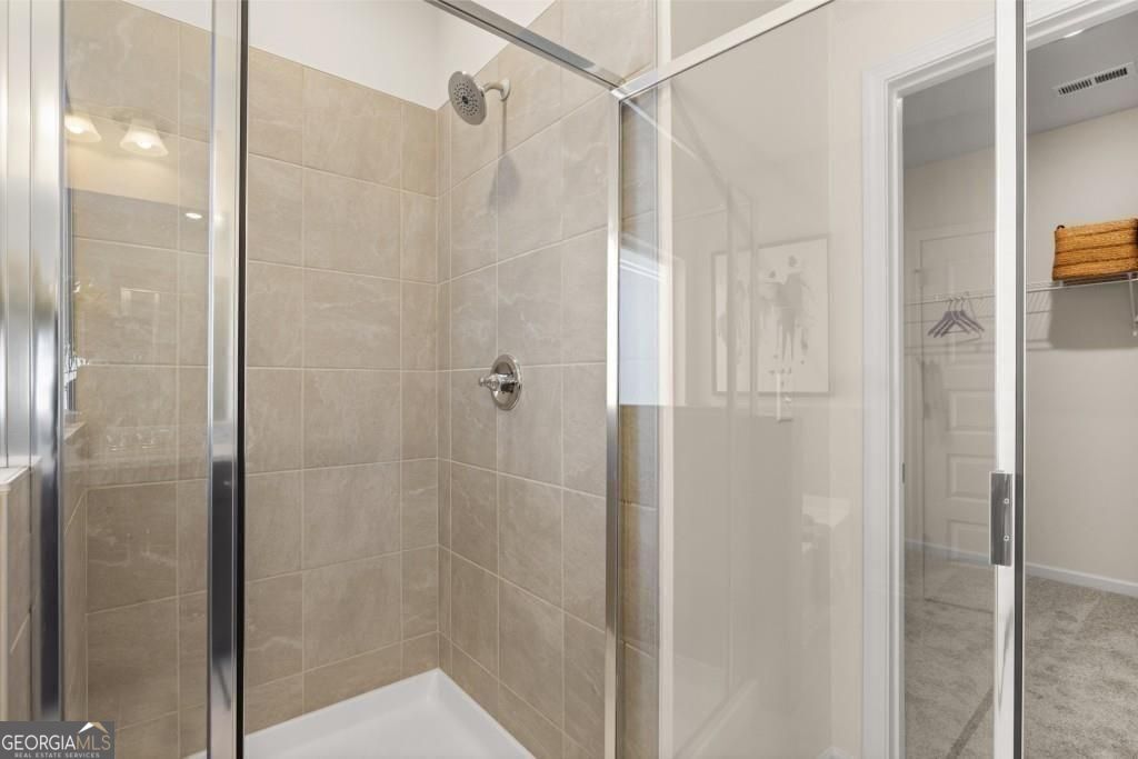 202 Sycamore Lane Calhoun, GA 30701 - Photo 33 of 48 a bathroom with a glass shower door