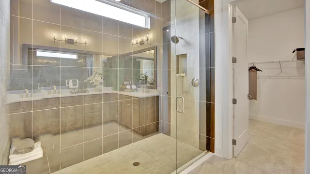 a living room with fireplace furniture and a chandelier