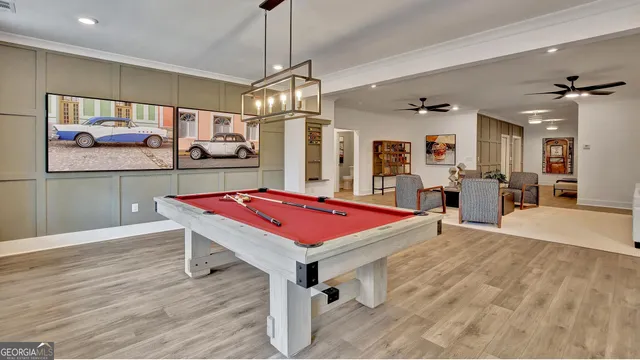 a living room with furniture and large windows