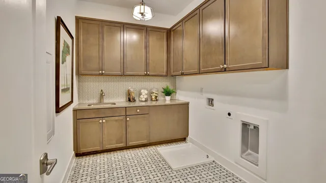 a bathroom with double vanity sinks and a large mirror
