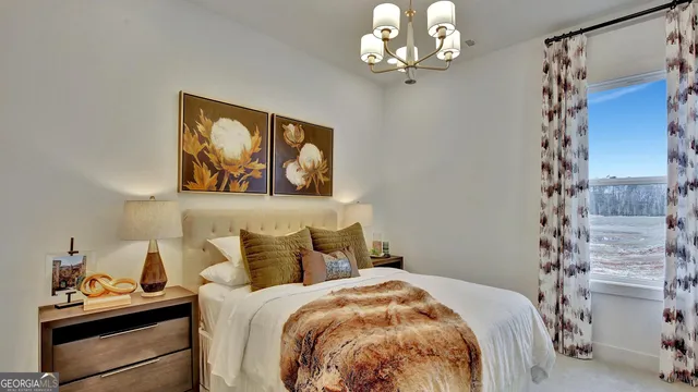 a spacious bedroom with a bed and a window