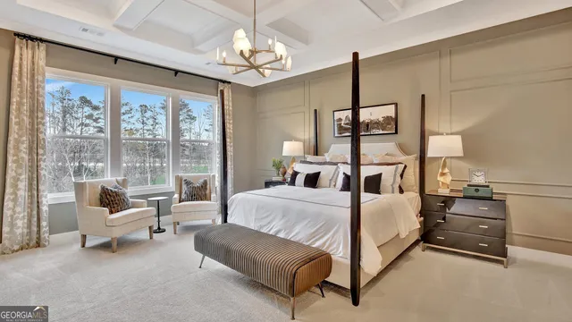 a en suite bathroom with a granite countertop sink and a large mirror