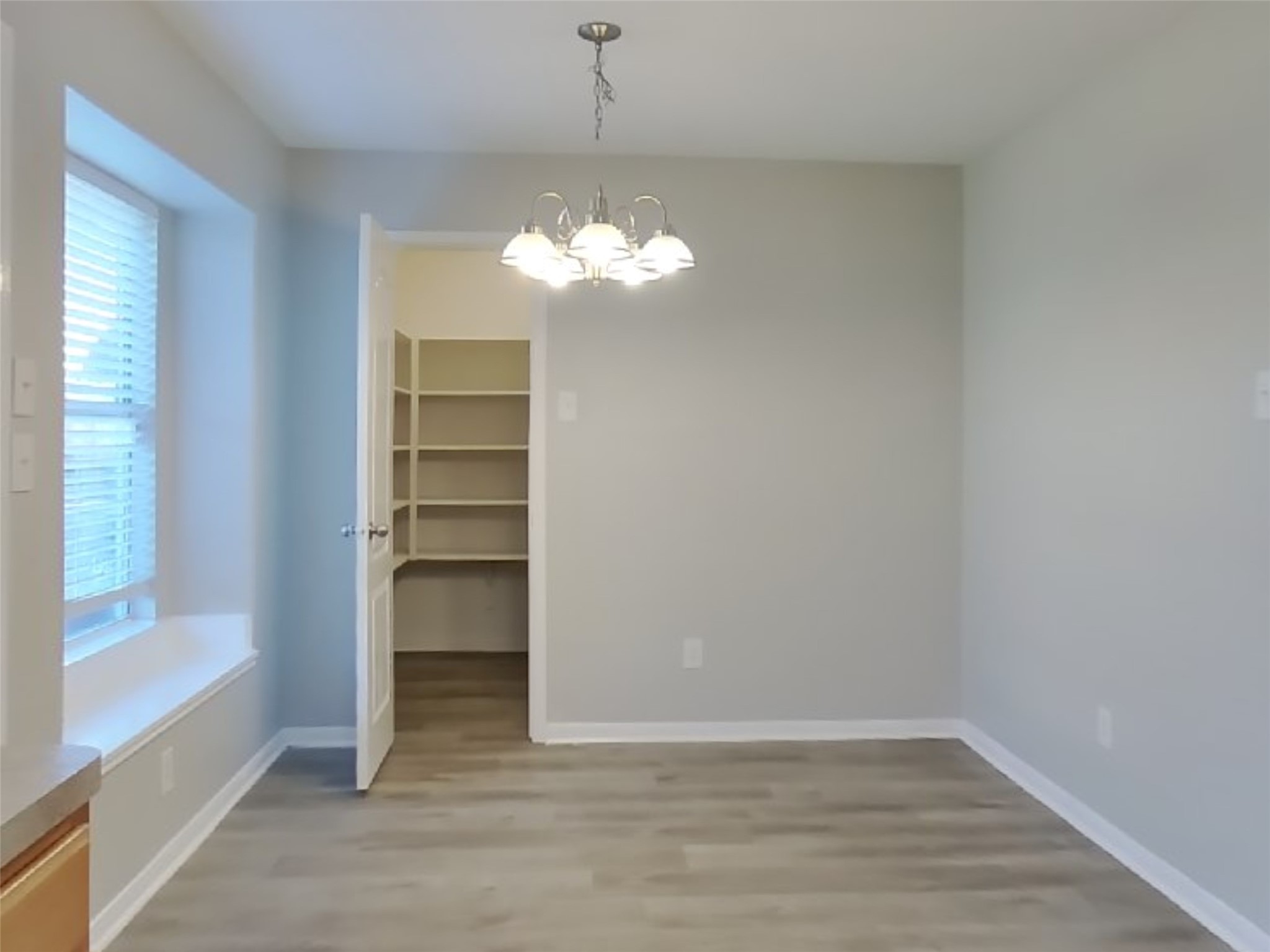 1910 Flycaster Drive Spring, TX 77388 - Photo 6 of 19 a view of a livingroom with a large window chandelier fan and windows