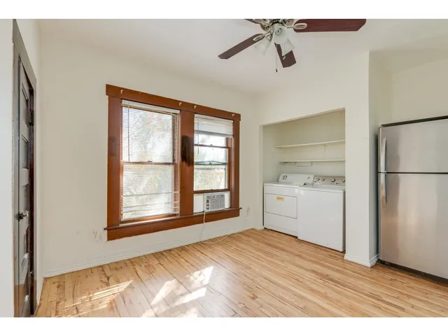 a view of a kitchen with a sink dishwasher and a refrigerator
