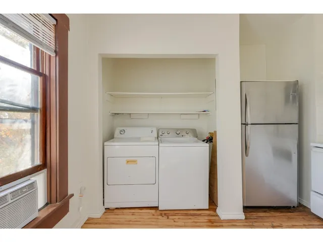 a view of storage and utility room with washer and dryer