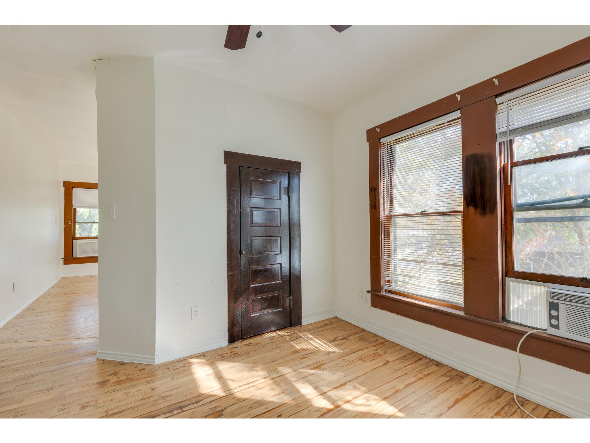 106 South S Avenue South, Unit D Elgin, TX 78621 - Photo 13 of 15 a view of a livingroom with wooden floor and a window