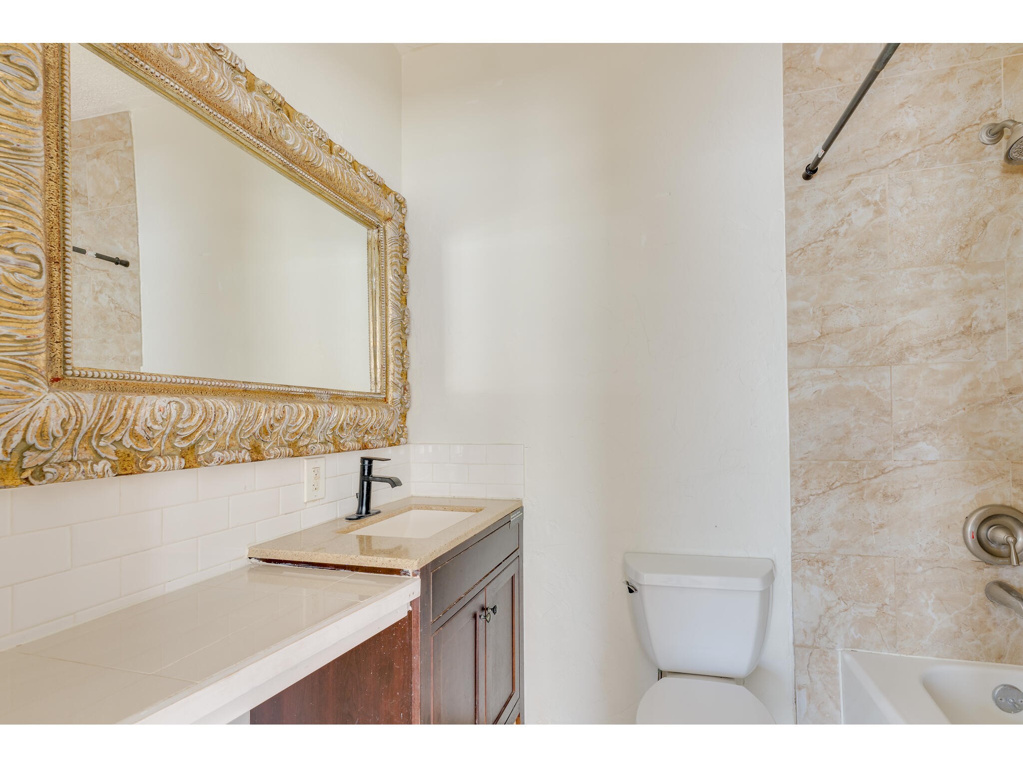 106 South S Avenue South, Unit D Elgin, TX 78621 - Photo 8 of 15 a bathroom with a sink and a mirror