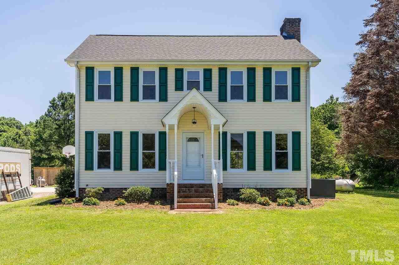 9320 Tallgrass Road Raleigh, NC 27603 - Photo 1 of 28 a front view of a house with a yard