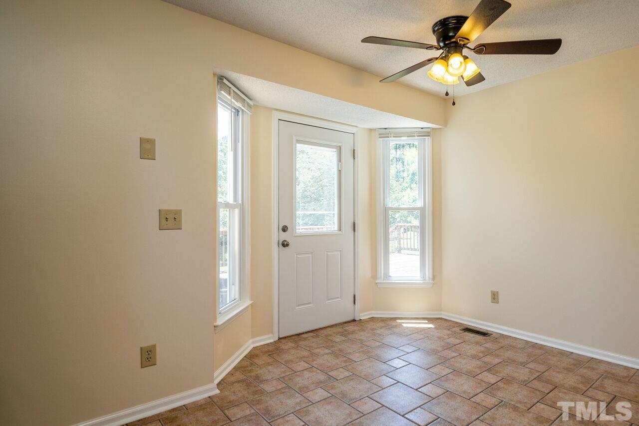 9320 Tallgrass Road Raleigh, NC 27603 - Photo 11 of 28 an empty room with windows and fan