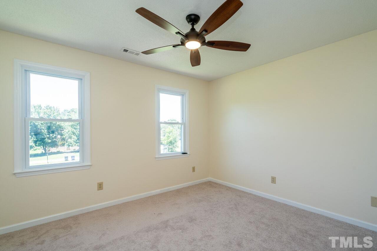 9320 Tallgrass Road Raleigh, NC 27603 - Photo 18 of 28 a view of an empty room with a window