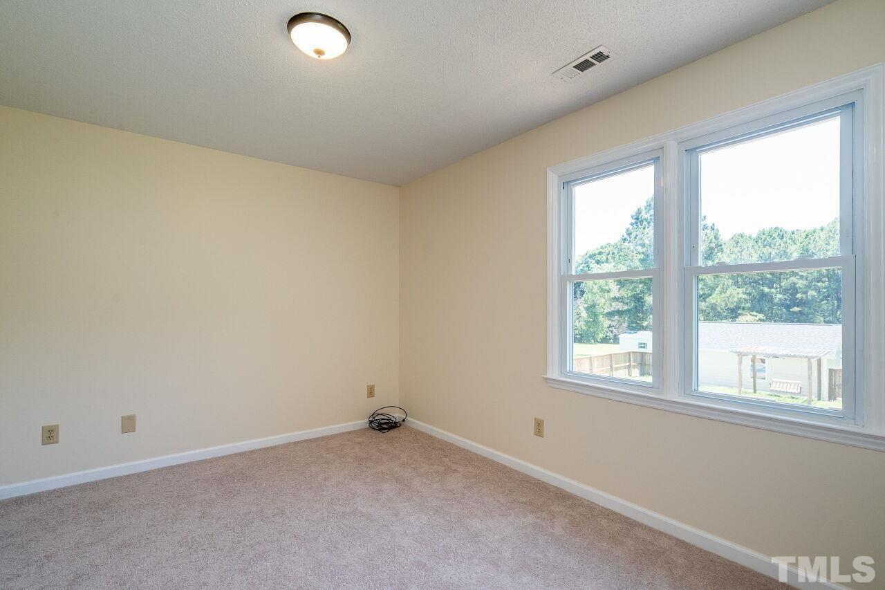 9320 Tallgrass Road Raleigh, NC 27603 - Photo 20 of 28 an empty room with a window