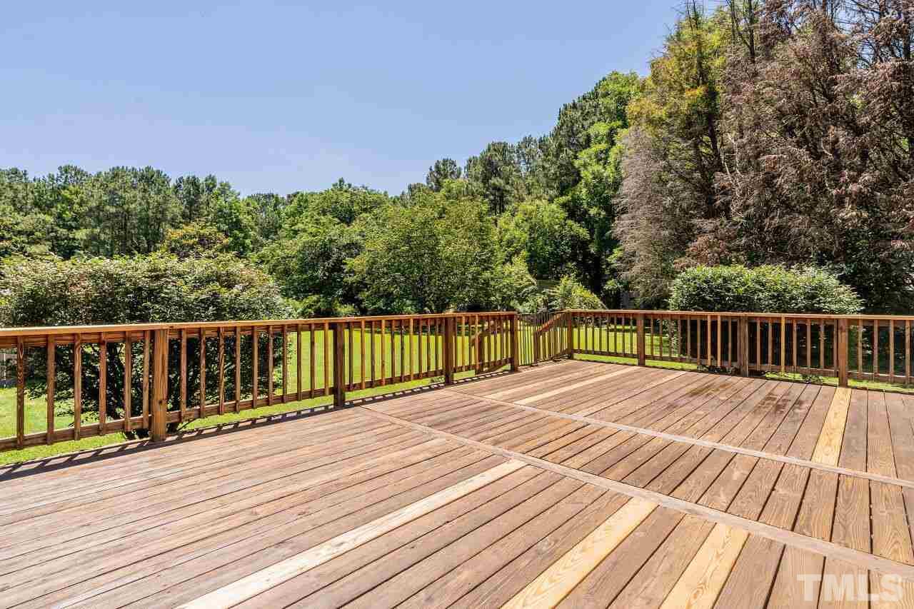 9320 Tallgrass Road Raleigh, NC 27603 - Photo 21 of 28 a view of deck with wooden floor and fence