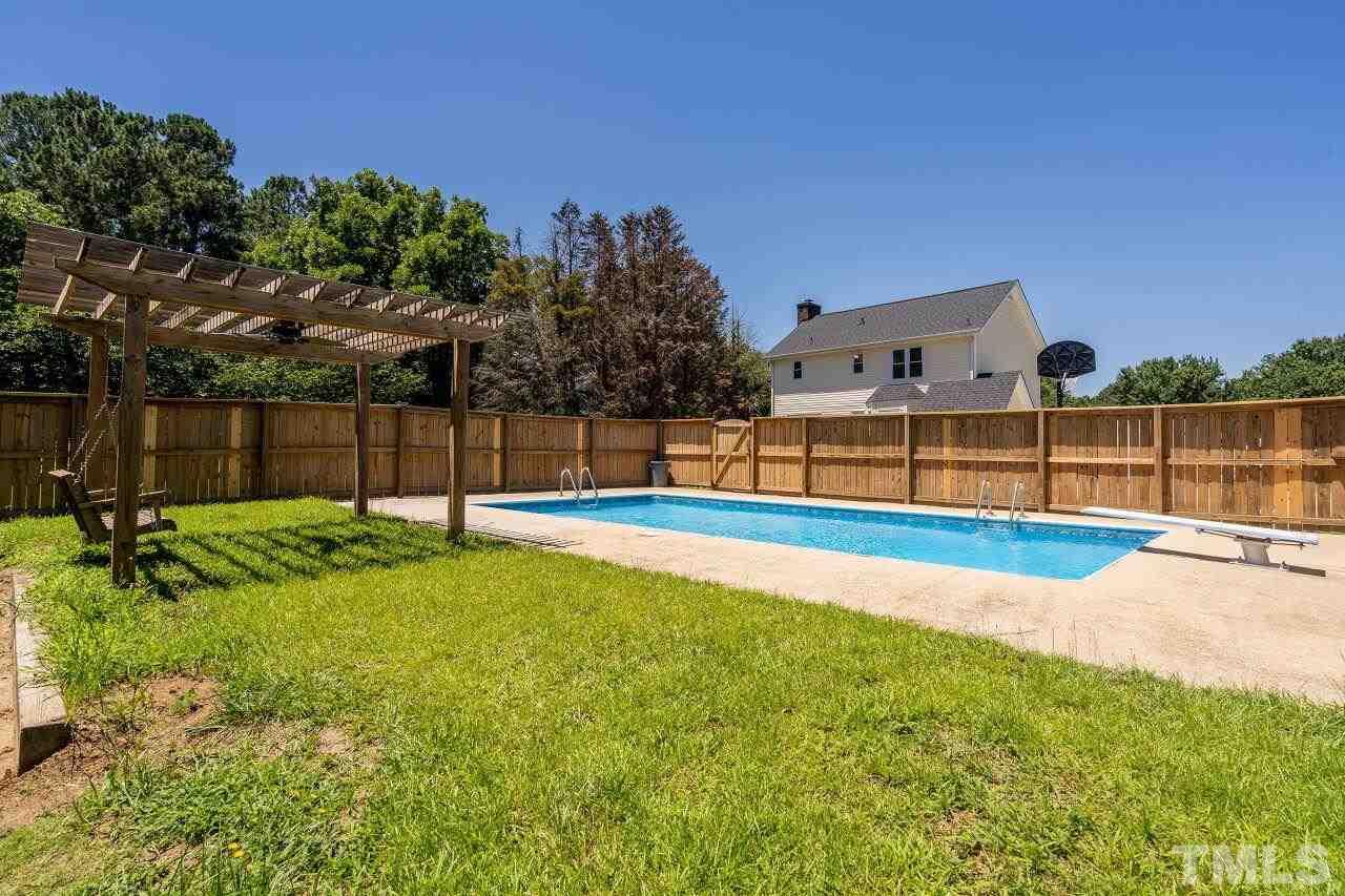 9320 Tallgrass Road Raleigh, NC 27603 - Photo 24 of 28 a view of a backyard