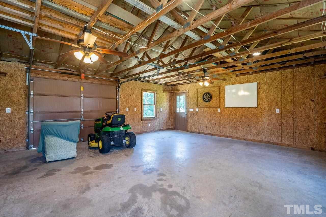 9320 Tallgrass Road Raleigh, NC 27603 - Photo 25 of 28 a view of a room with gym equipment