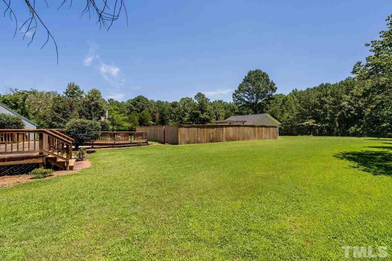 9320 Tallgrass Road Raleigh, NC 27603 - Photo 26 of 28 a view of yard with swimming pool and green space