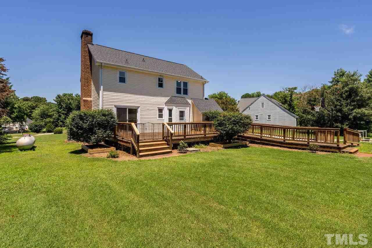 9320 Tallgrass Road Raleigh, NC 27603 - Photo 27 of 28 a house view with a garden space