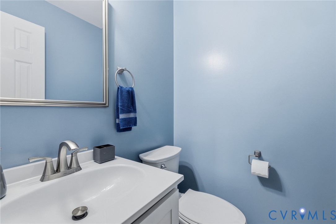 10315 Raintree Commons Court Henrico, VA 23238 - Photo 16 of 24 White vanity with an integrated sink and brushed n