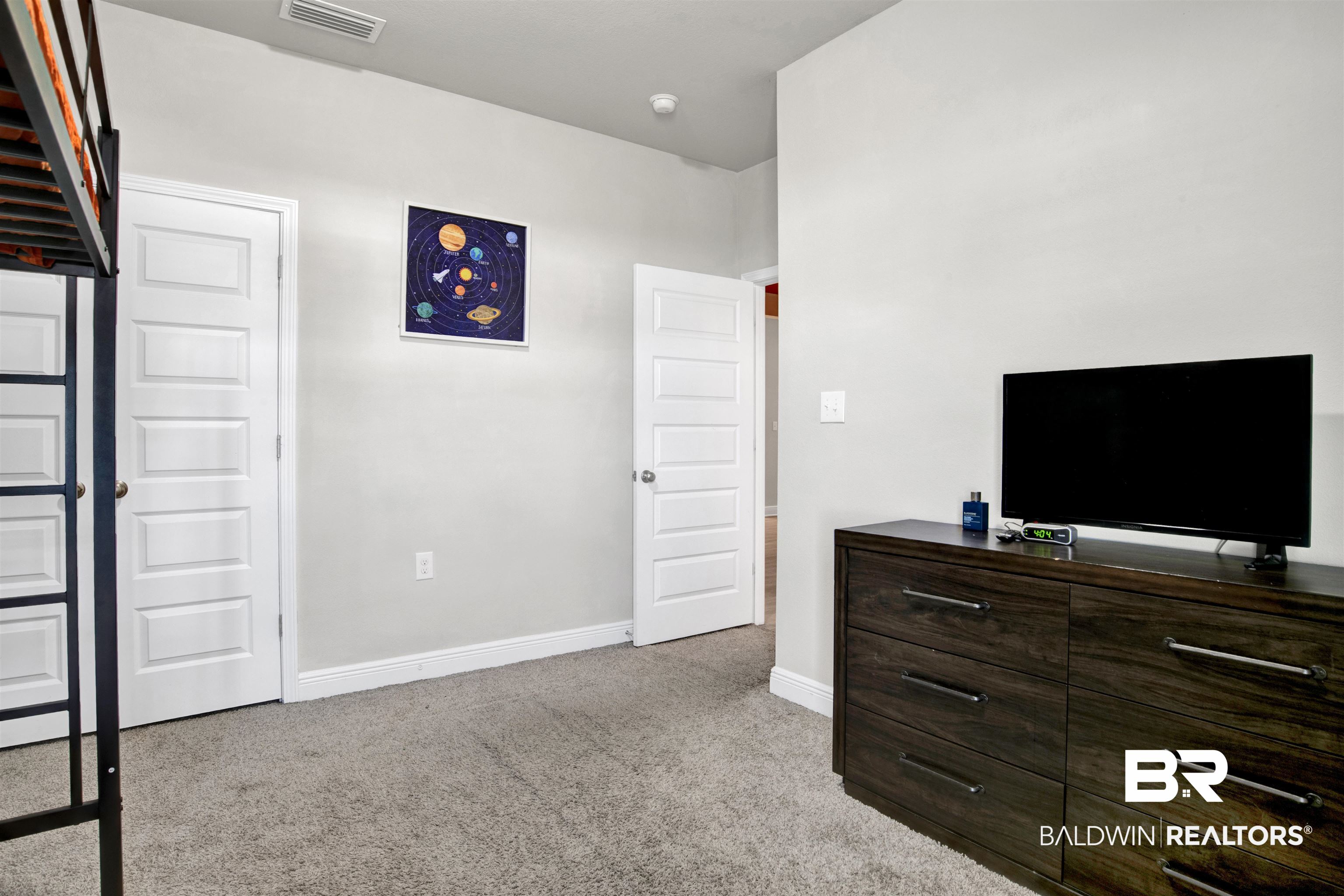 24253 Alydar Loop Daphne, AL 36526 - Photo 22 of 44 Bedroom featuring light carpet and baseboards