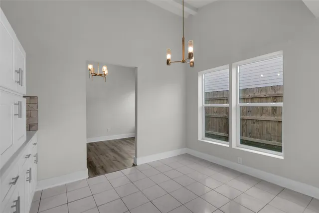 a view of empty room with windows