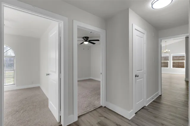 wooden floor with white walls