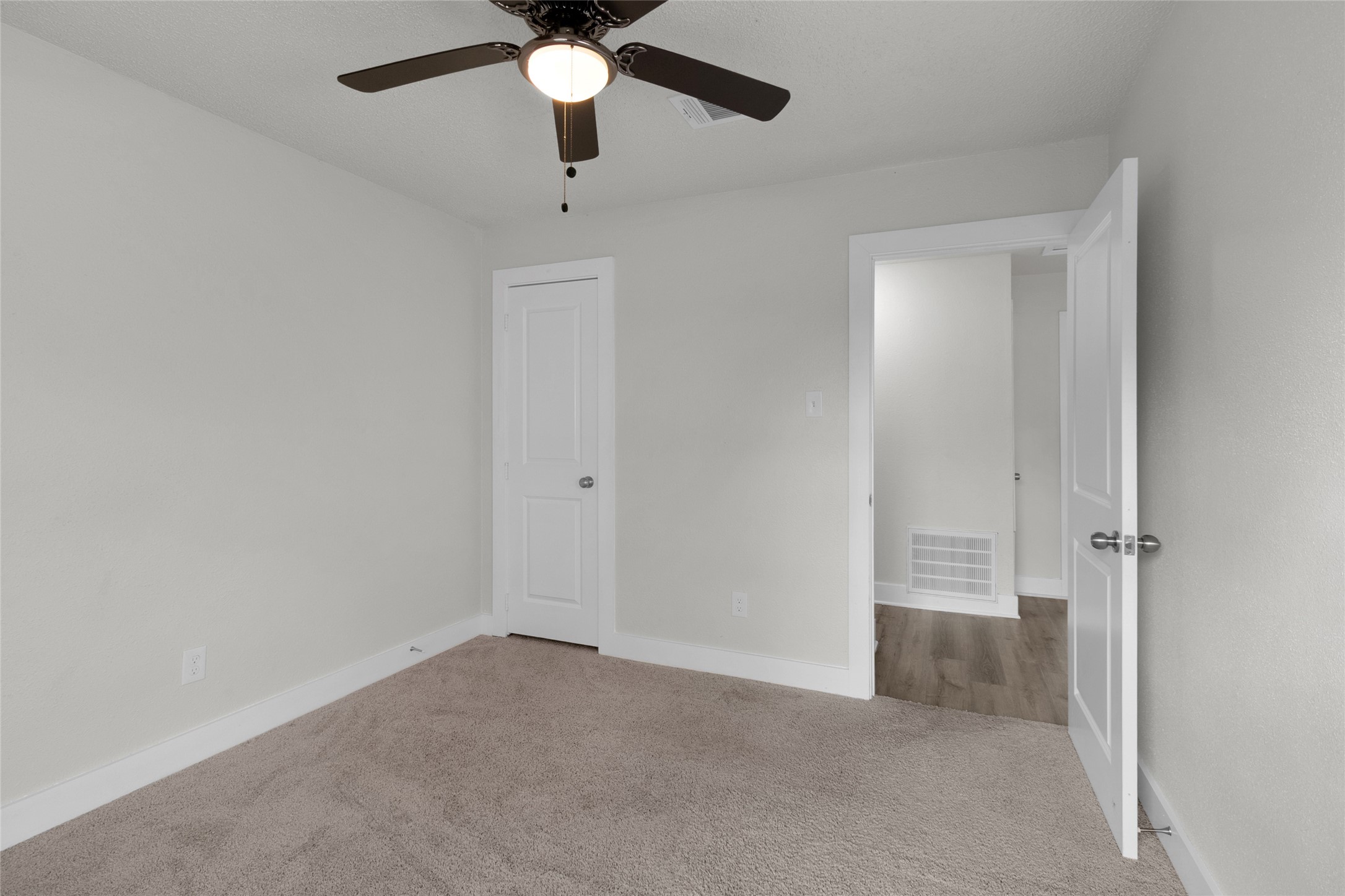 23910 Spring Briar Lane Spring, TX 77373 - Photo 19 of 38 an empty room with a ceiling fan and a window