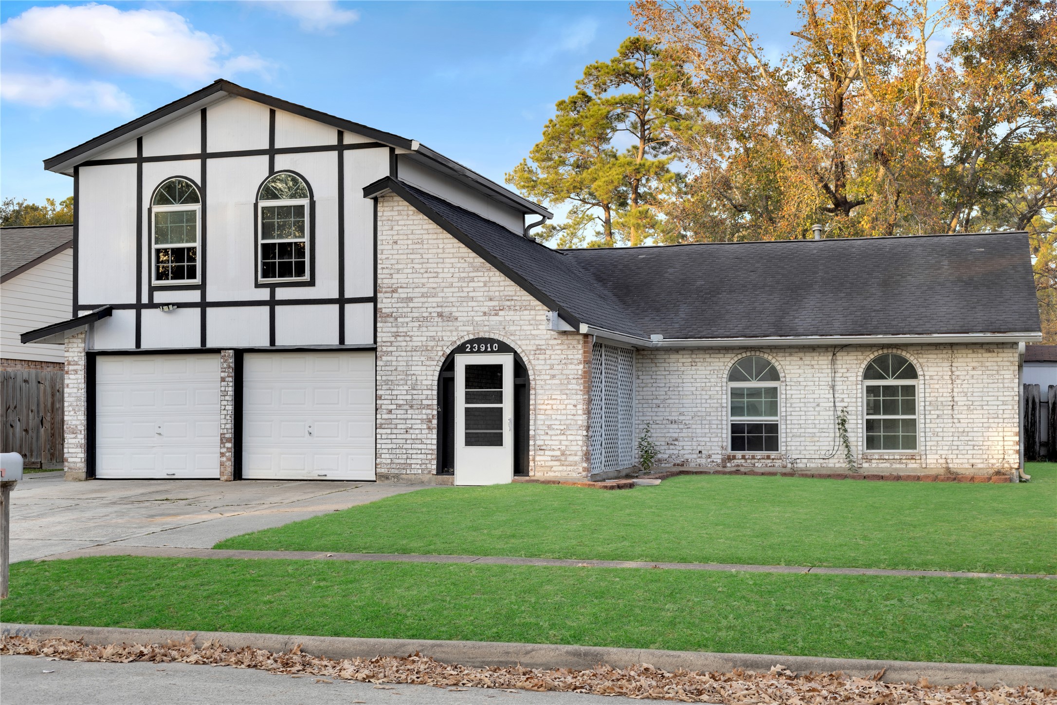 23910 Spring Briar Lane Spring, TX 77373 - Photo 2 of 38 a front view of a house with a yard and garage