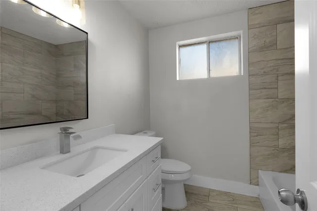 a bathroom with a sink and a toilet